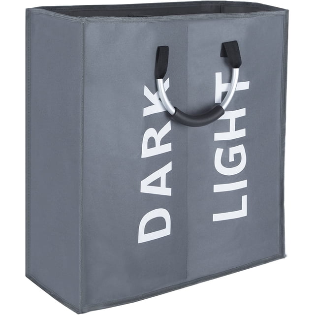 Double laundry bag in dark grey with two sections labeled 'DARK' and 'LIGHT' for separating clothes. Features aluminum ring handles with soft grips for easy carrying. Made of durable 600D polyester with thick EVA coating. Dimensions are 20.5 inches long, 9 inches wide, and 21 inches high, offering a large capacity.