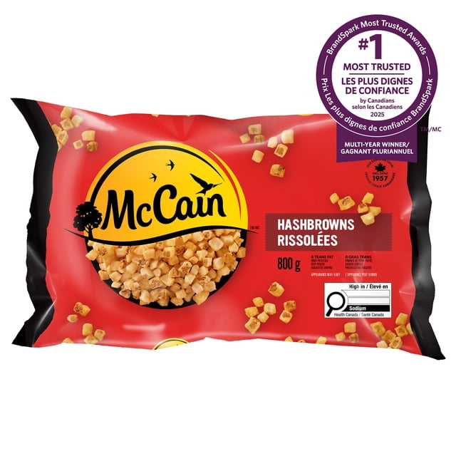 McCain® Diced Hashbrowns 800g frozen potatoes package with red and black design, featuring the yellow McCain logo and scattered diced hashbrowns, labeled trans-fat and cholesterol free, high in sodium, and recognized as a multi-year BrandSpark Most Trusted Award winner in Canada, suitable for quick pan-frying.
