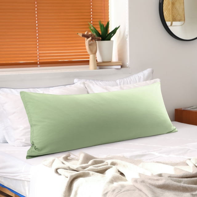 PiccoCasa Brushed Microfiber Pillowcase Body Pillow Pillowcase in jumbo sage, measuring 20 x 72 inches. The pillowcase features a soft and durable 1800 series brushed microfiber fabric with a zipper closure to keep the pillow secure. Displayed on a neatly made bed in a cozy bedroom setting with natural light and decor elements.