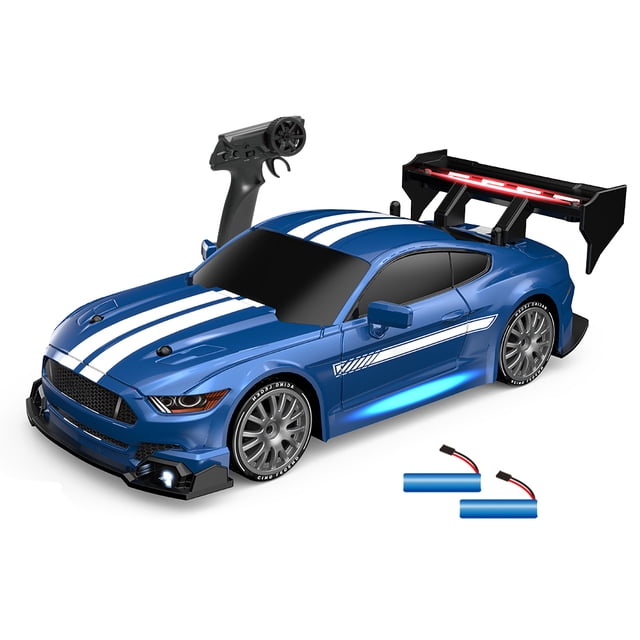 Graflsoa 1:24 Scale 2.4GHz Remote Control Mustang Drift Car in blue with LED lights, dual batteries, and replaceable wheels. Features a sleek design with white racing stripes, a rear spoiler, and illuminated undercarriage. Includes a remote controller, two rechargeable batteries, four replaceable drift wheels, and roadblocks. Designed for high-speed drifting up to 30km/h with 4WD traction and a brushed motor. Suitable for flat, dry surfaces.