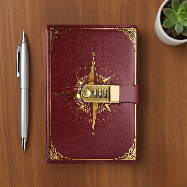 Zenithome A5 Classic Lockable Password Diary with Compass Design, shown on a wooden desk. The diary has a red imitation leather cover with an embossed gold compass pattern and a combination lock for security. A silver pen and a small potted plant are nearby, highlighting its use as a secure journal for writing and note-taking.