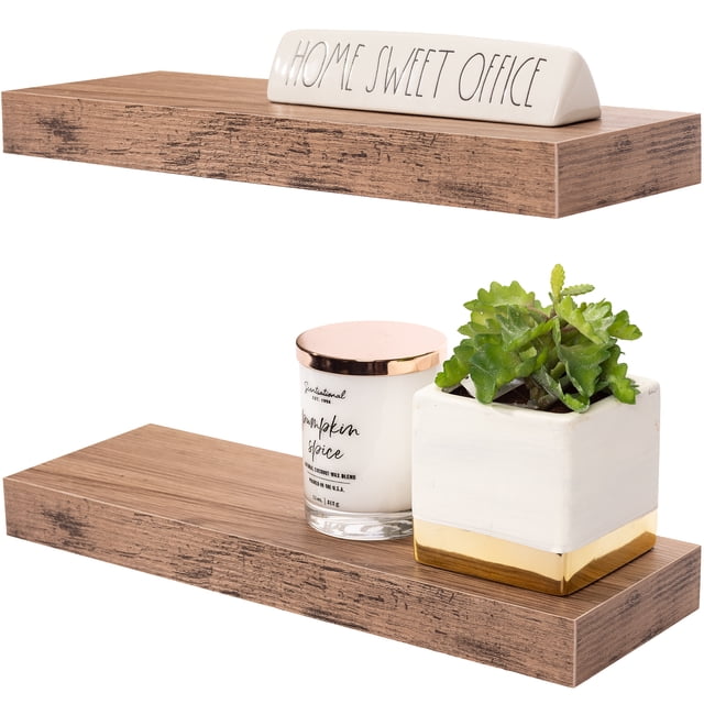 Sorbus Floating Shelf Set — Rustic Wood Hanging Rectangle Wall Shelves in mahogany finish, shown as a set of two. Each shelf displays decorative items, including a ceramic sign, a candle, and a small potted plant. Perfect for wall-mounted storage, space-saving design, and home décor. Made of MDF with PVC and bracket, supporting up to 8 pounds per shelf. Mounting hardware included.