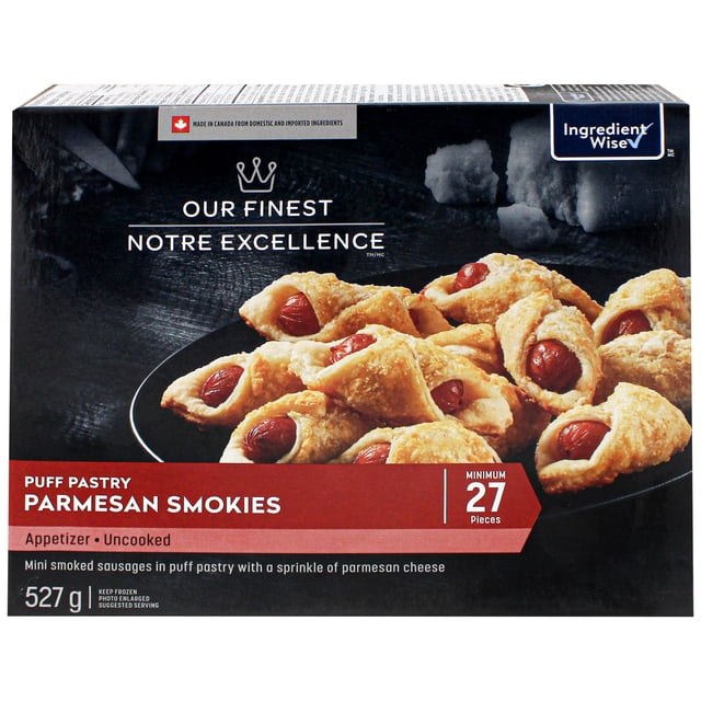 Our Finest Puff Pastry Parmesan Smokies frozen appetizer box containing 27 mini smoked sausages wrapped in flaky puff pastry sprinkled with parmesan cheese, weighing 527 g, uncooked and made in Canada, ideal for quick oven preparation and entertaining.