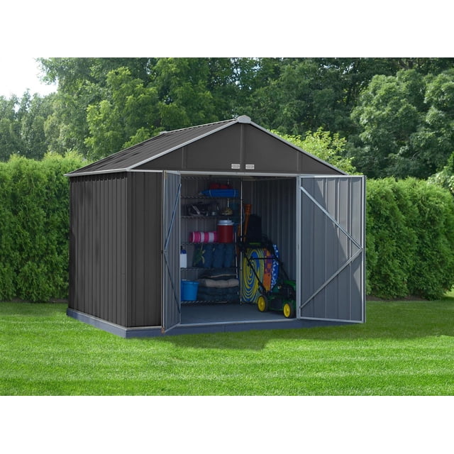 EZEE Shed Steel Storage 10 x 8 ft. galvanized extra high gable charcoal with cream trim, front-facing with open double swing doors revealing metal shelving stocked with outdoor gear and a lawn mower inside, set on green lawn with trees and shrubs behind, ideal for storing garden tools and bulky outdoor items