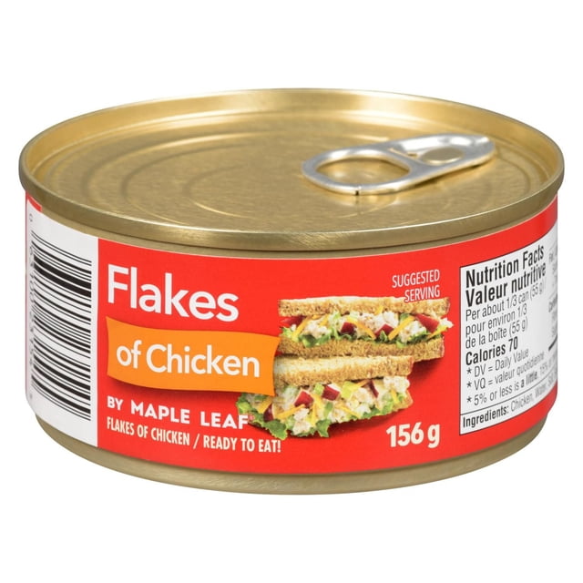 Flakes of Chicken by Maple Leaf canned shredded chicken in a 156 g gold metal can with a red label featuring a chicken salad sandwich, nutrition facts, and a pull-tab lid, shelf-stable for convenient use in sandwiches, soups, salads, and casseroles.