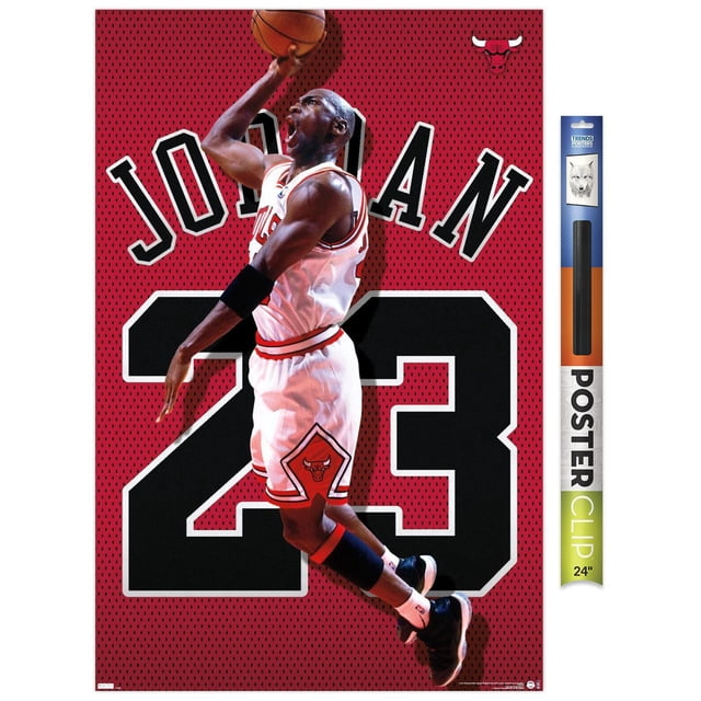 Michael Jordan - Jersey Wall Poster, 22.375" x 34" framed, depicting Michael Jordan in a white Chicago Bulls uniform with number 23, jumping with a basketball against a red perforated background featuring large black number 23 and 'JORDAN' text, plus the Bulls logo in the top right corner. Printed on glossy PhotoArt paper with a modern frame and lightweight design, suitable for bedroom, office, or dorm decor.