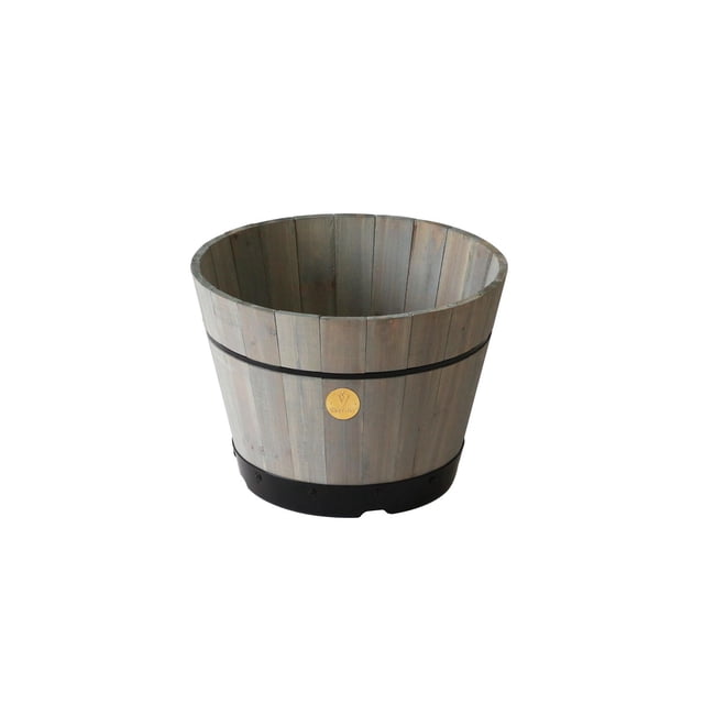 VegTrug 18" Build-a-Barrel Kit in grey wash, a round garden planter made from durable 100% FSC certified wood with vertical slats, featuring a black plastic base for optimal drainage and aeration, and a small circular VegTrug logo plaque on the front. Suitable for patio or garden use and ideal for potted plants.