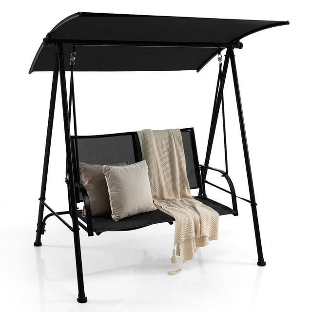 Costway Balançoire de Patio à 2 Places, Balançoire de Porche avec Auvent Ajustable pour Jardin en Noir. Conçue avec un Cadre Métallique Robuste et des supports Triangulaires, Elle Présente un Siège en Tissu Respirant pour Deux et un Auvent convertible pour l'Ombre Ou l'Exposition au Soleil. Comprend des Accoudoirs Courbés, des Patins Antidérapants et une Capacité de Charge de 600 Lb. Idéale pour les Espaces Extérieurs comme les patios, les Jardins et les Zones au Bord de la Piscine, Cette Balançoire avec Auvent Offre Confort et Durabilité.