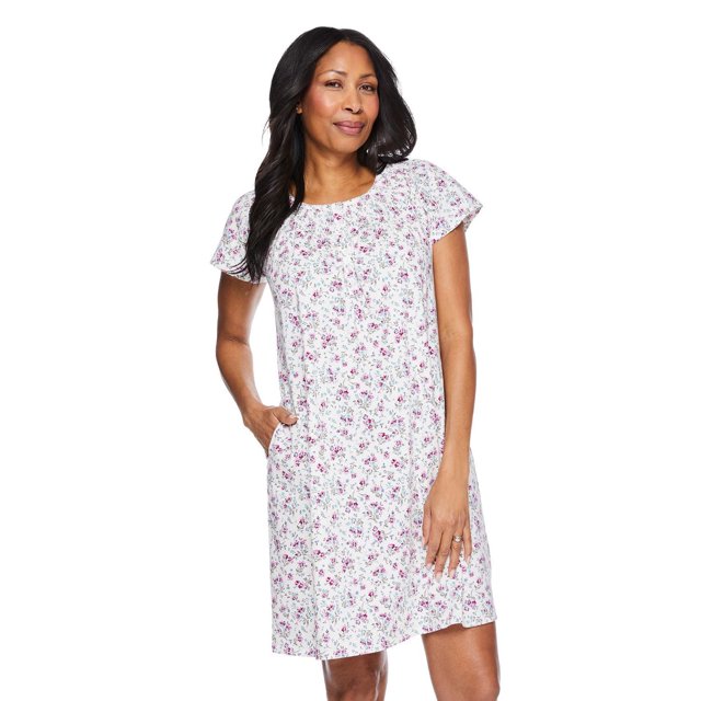 Iyla Women's Nightgown in white 100% cotton jersey knit with a pink and green floral all-over print, featuring a crew neckline, short raglan sleeves, 6-button placket, smocked yoke, picot trim, and two on-seam pockets. Ideal for women's sleepwear and comfortable loungewear.