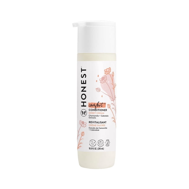Honest Revitalisant Crème Sucrée en Bouteille Cylindrique Blanche de 295 ml avec Bouchon à Pompe Blanc, Présentant des illustrations Florales de Camomille et de calendula, une Formule Sans Larmes et Hypoallergénique Qui Hydrate et Adoucit Tous les types de Cheveux.