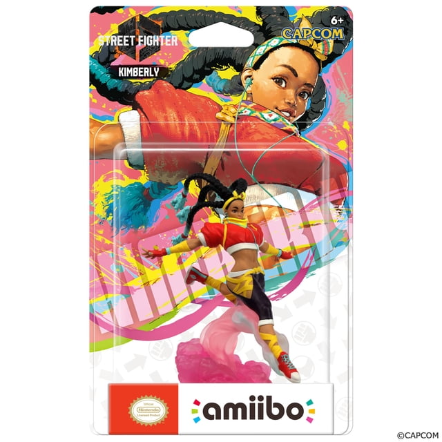 STREET FighterTM 6 Kimberly Figurine AmiiboTM dans une pose de Saut Dynamique Portant une Veste Courte Rouge, des shorts Jaunes par-Dessus des leggings Noirs et des Espadrilles Rouges, Emballée sur un Dos Coloré avec des logos STREET FIGHTER et CAPCOM, compatible avec les Systèmes Nintendo Switch™ pour Débloquer des Récompenses Exclusives en Jeu et Sauvegarder les Paramètres du Joueur.