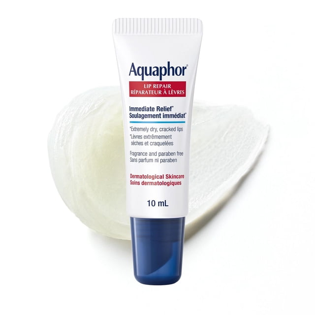 Aquaphor Lip Repair Lip Ointment for Extremely Dry, Chapped and Cracked Lips in a 10 mL white tube with a blue cap, front-facing, showing text about immediate relief, fragrance and paraben free formula, and dermatological skincare, placed over a translucent ointment smear on a white background, ideal for sensitive lips and dry, cold conditions.