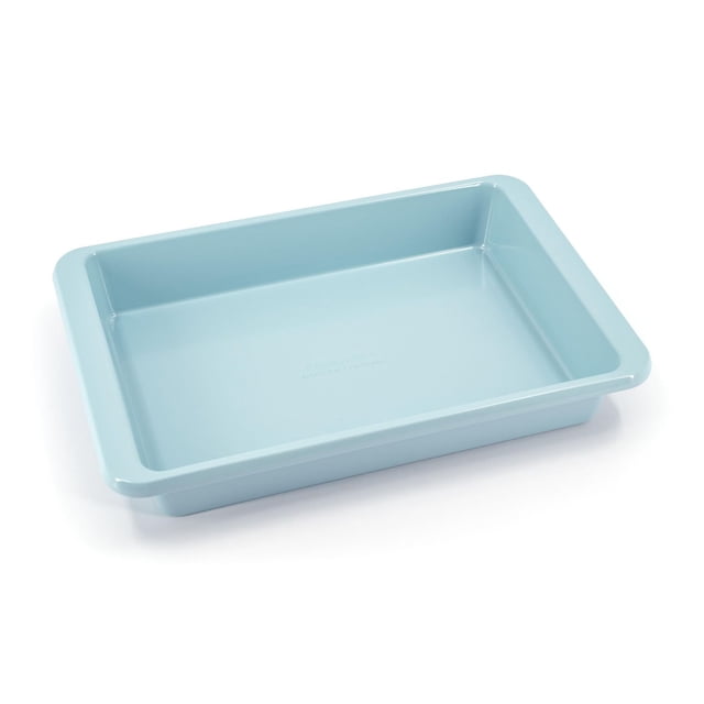 KitchenAid 9x13-inch Cake Pan Mineral Water in a front angled view showing its rectangular shape with light blue nonstick aluminized steel surface and extended handles for secure grip, designed for even heat distribution and ideal for baking cakes, brownies, and casseroles.