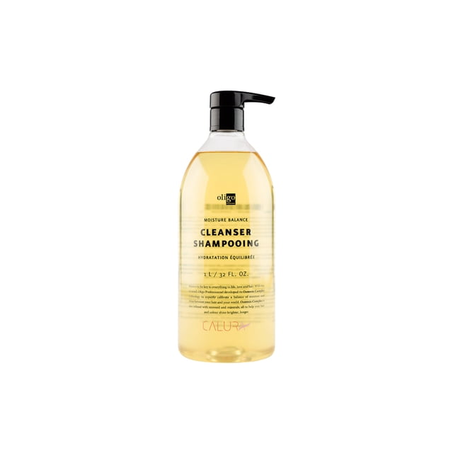 Oligo Calura Nettoyant Équilibrant l'Humidité 1 L dans une Bouteille à Pompe Transparente avec un Liquide Doré, Conçu pour Prolonger la Couleur des Cheveux et Rehausser l'Éclat. Présente des Propriétés Véganes, Sans Parabènes, Sans Gluten, Sans Sulfates et Sécuritaires pour la Couleur. Convient au Maintien de Cheveux Vifs et en Santé.