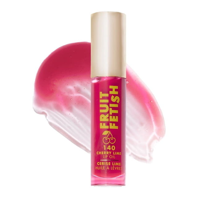 Milani Fruit Fetish Lip Oil Cherry Lime in a clear tube with gold cap, showing bright pink tinted oil and gold lettering, placed over a glossy pink lip oil smear, providing instant hydration and nourishing treatment with a non-sticky formula.