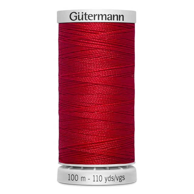 Gutermann Extra Strong 100% Polyester Thread spool in red, tightly wound on a white plastic bobbin labeled with brand name and 100 m (110 yds) length, designed for heavy-duty sewing on leather, canvas, and home décor fabrics.