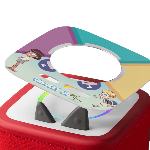 tonies Tonieplay Unlucky Jo Game disc with colorful cartoon characters and title on a square disc with central circular cutout, placed on a red Toniebox 2 with white top and black ear buttons, designed for interactive, screen-free educational play for kids ages 3 to 9.