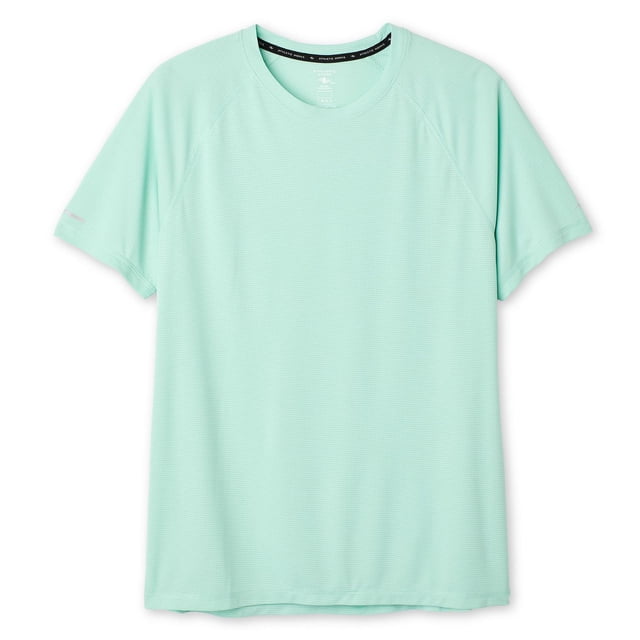 Athletic Works Men's Relaxed Fit T-Shirt in light mint green, made from breathable mesh with DRI-MORE moisture-wicking technology, featuring a crew neck, short raglan sleeves with reflective trim, and a straight hem, ideal for workouts or casual wear.