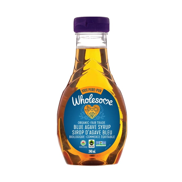 Wholesome Sweeteners Organic Blue Agave Syrup in a 240 ml clear plastic bottle with a purple cap, featuring a blue label with organic and fair trade certifications. This low glycemic syrup is sweeter than sugar and suitable for baking, margaritas, smoothies, and adding sweetness to fruit.