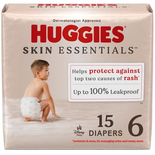 Huggies Skin Essentials Baby Diapers size 6, pack of 15, featuring a toddler wearing a white diaper with Disney baby patterns, dermatologist approved for sensitive skin, up to 100% leakproof, designed to protect against rash caused by moisture and mess.