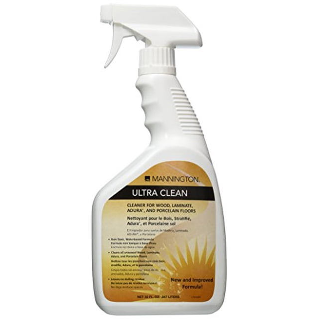 Mannington Ultra Clean 32oz Spray Bottle, a non-toxic, water-based cleaning solution designed for wood and laminate floors. The bottle features a trigger spray nozzle and a label highlighting its residue-free formula and suitability for various surfaces. Ideal for maintaining clean and polished flooring.