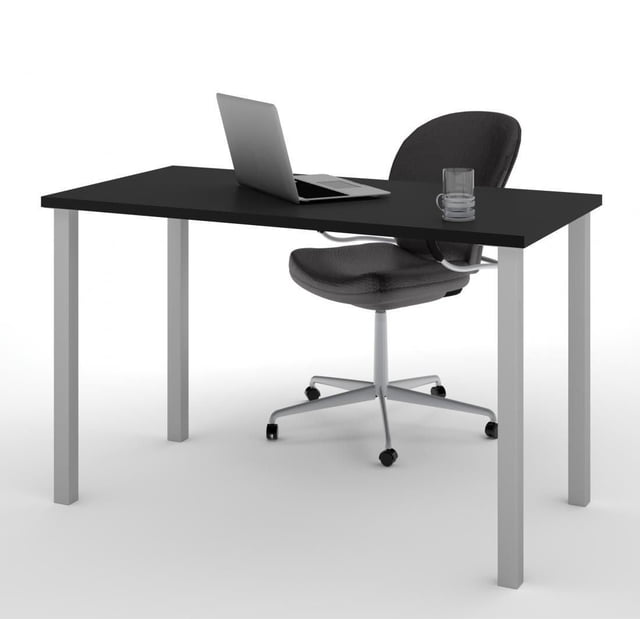 Bestar 24" X 48" Table with Square Metal Legs featuring a durable black melamine work surface resistant to scratches and stains, supported by matte silver square metal legs with levellers, shown with a black swivel office chair, laptop, and glass cup, suitable for versatile home or office use.