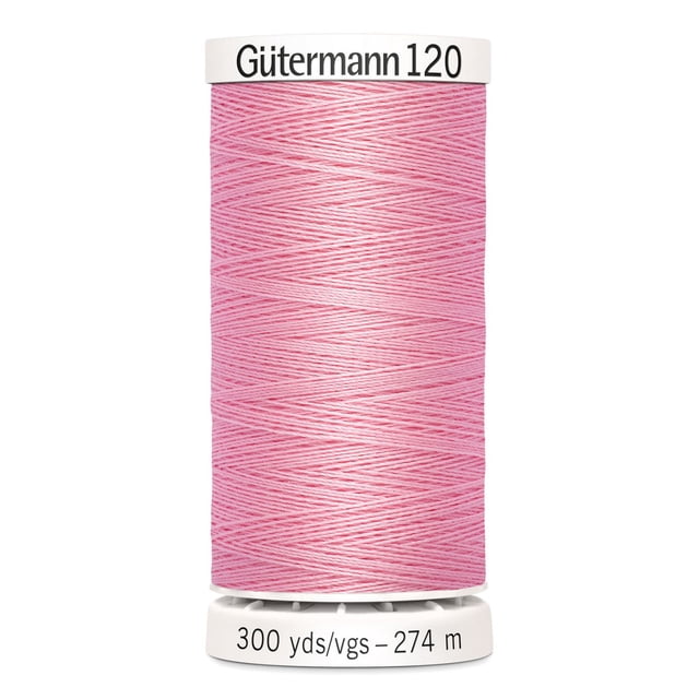 Gutermann 120 100% polyester all purpose thread spool in pink, tightly wound with label showing 300 yards (274 meters), suitable for machine and hand sewing various fabrics including cotton and synthetics.