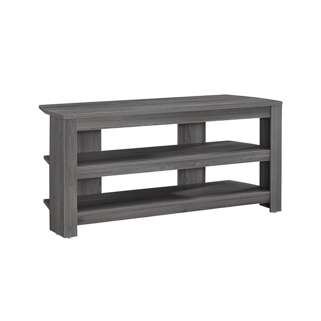 Monarch Specialties TV Stand, 42 inch grey laminate console with a contemporary modern design, featuring two fixed open shelves for media storage and supporting up to a 40 inch flat screen TV, shown front-facing on a white background, also suitable as a compact storage unit for books or decorative items.