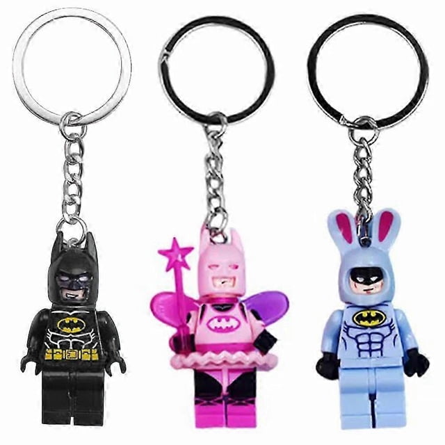 Batman Fairy 3D Keychain set featuring three designs: a black Batman with yellow accents, a pink fairy Batman with wings, wand, and tutu, and a blue Batman with bunny ears. Crafted from building block-style materials, these novelty keychains are perfect for keys, backpacks, or as collectible gifts for superhero fans.