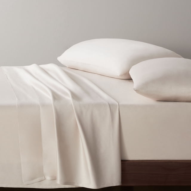 Allswell 300 Thread Count Soft & Silky 4-Piece Viscose from Bamboo Sateen Sheet Set in light beige on a wooden bed frame, including a flat sheet draped over the side, fitted sheet on mattress, and two pillowcases made from breathable, moisture-wicking bamboo fabric with a smooth sateen weave, ideal for all seasons and everyday use.