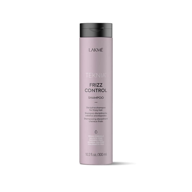 Lakmé Frizz Control Shampoo in a 300 ml bottle. The sulfate-free formula moisturizes and restores softness to frizzy, rebellious, and voluminous hair. Suitable for straight and curly hair, it reduces frizz by 68% and provides a natural feel. The bottle is lavender with black and white text.