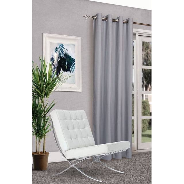 Gouchee Design Alice Room Darkening Panel in grey with 8 silver metal grommets hanging on a curtain rod in a modern room with a white tufted chair, potted plant, and framed bird artwork on a grey wall, suitable for reducing light and noise.