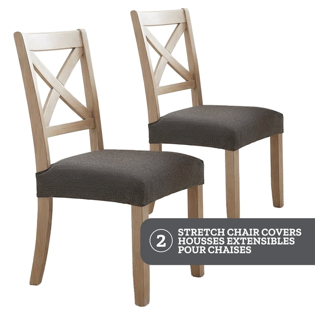 SmartFit Stretch Herringbone Dining Chair Covers: Set of 2, Charcoal Gray centered front-facing view of two fitted dining chair covers in charcoal gray with subtle herringbone weave; high-stretch knit conforms to seat and back, elastic bottom and securing strap keep cover in place, fits seat cushions 17 to 20 in. wide and 15 to 20 in. long, machine washable. Often used to quickly refresh rental or temporary dining seating.