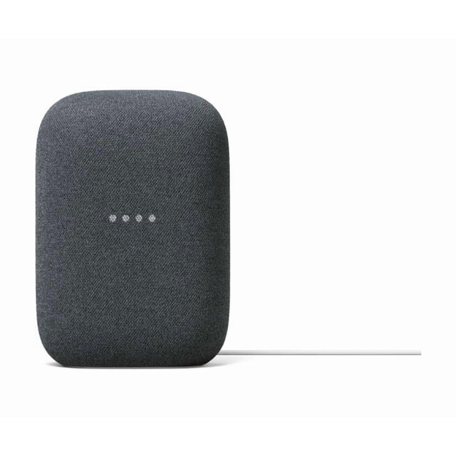 Google Nest Audio - Smart Speaker in a sand-colored fabric finish, featuring a compact, rectangular design with rounded edges. The front displays four LED lights indicating activity. This wireless speaker offers rich sound with a woofer, tweeter, and tuning software for crisp vocals and powerful bass. It is 75% louder than the original Google Home and has 50% stronger bass. Compatible with Google Assistant for voice control, it supports streaming music, podcasts, and audiobooks, and can integrate with other Nest devices for a home audio system.
