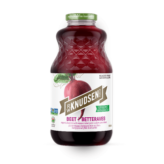 R.W. Knudsen Organic Beet juice in a clear glass bottle with a green cap and white label featuring a red beet illustration. This USDA-certified organic, Non-GMO vegetable juice contains no added sugar and is suitable for smoothies, cocktails, or enjoyed on the rocks.