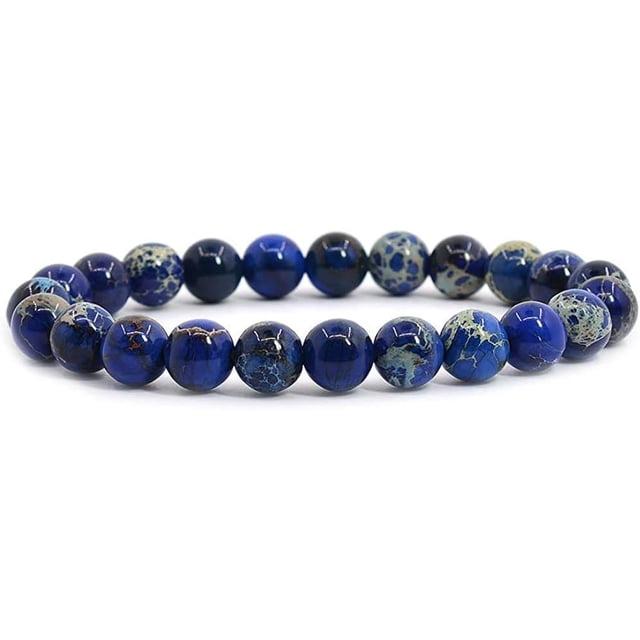 Bracelet Extensible en Perles Rondes de 8 mm en Jaspe de Sédiment Marin Bleu Royal, 7 Pouces. le Bracelet Présente des Pierres Précieuses Rondes Teintes et Stabilisées en Bleu Royal vibrant avec des Motifs Naturels Uniques. Fait à la Main et Unisexe, Il Convient aux Hommes et aux Femmes. le Bracelet Mesure Environ 6,5 à 7 Pouces de Longueur et Est Sans Métal, le Rendant Idéal pour les Peaux Sensibles. Comprend une Pochette pour le Rangement.
