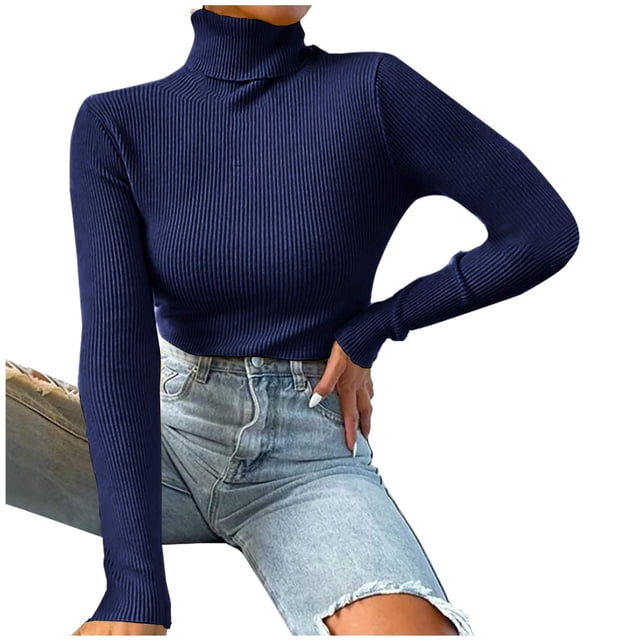 TIMIFIS Womens Long Sleeve Turtleneck Shirt in a solid navy blue colour, featuring a ribbed texture and slim fit design. The lightweight acrylic material offers comfort and flexibility, making it suitable for casual wear, layering, or active use during fall and winter. The model pairs the turtleneck with light-wash denim jeans, showcasing its versatility for various occasions.