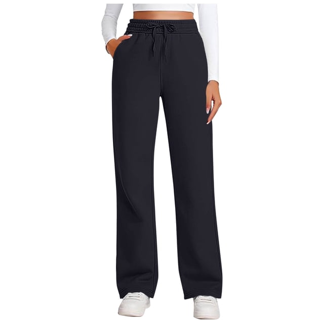 Posijego women's sweatpants in a solid black color, featuring a casual drawstring design, wide-leg fit, and elastic waistband. These straight-leg lounge pants are styled with a relaxed silhouette, ideal for athletic or casual wear. The model pairs the pants with a white cropped top and white sneakers, showcasing a versatile and comfortable look.