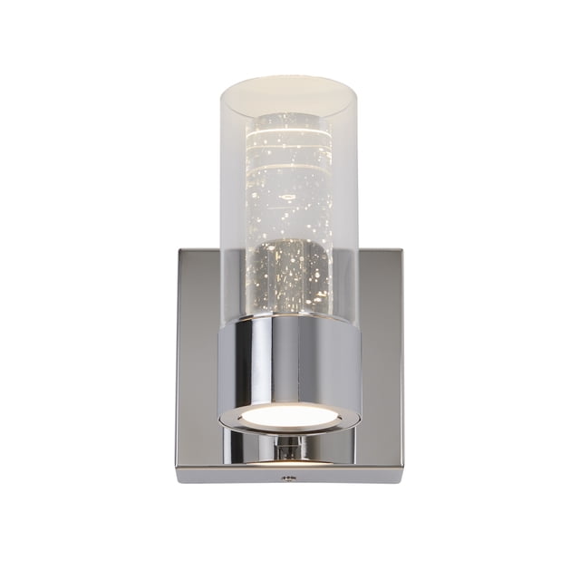 Artika Ratio Modern LED Wall Sconce Light Fixture in chrome, designed with a steel base and integrated LED technology for energy-efficient lighting. The cylindrical glass shade features sparkling bubble details, emitting a soft 450-lumen glow at 3000 Kelvin. Suitable for modern bathrooms, bedrooms, living rooms, or hallways.