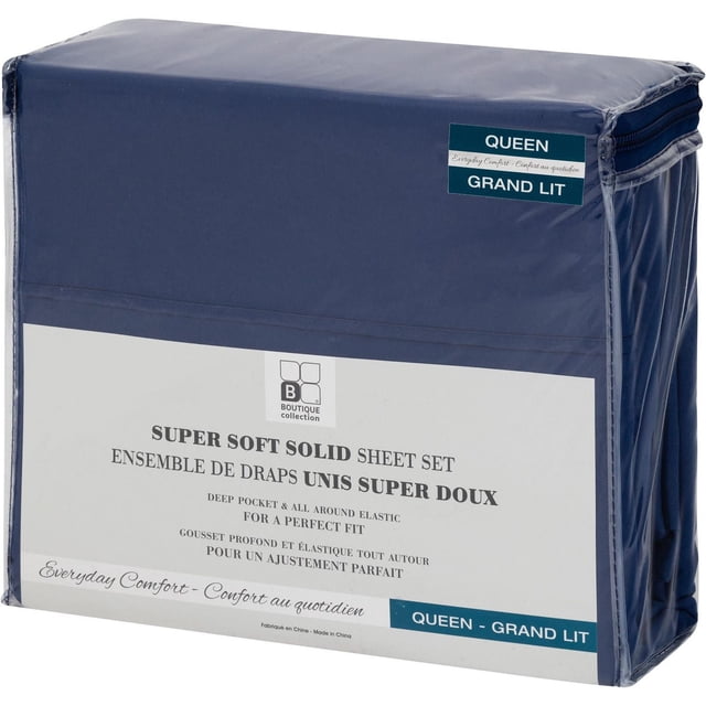 Ensemble de Draps Uni Ultra Doux Format Grand Lit en Bleu Marine, Emballé dans une Housse Transparente en Plastique avec Fermeture Éclair et Étiquette Blanche de la Collection Boutique, Doté d'Une Poche Profonde et d'Un Élastique Tout Autour pour un Ajustement Parfait, Convient comme Ensemble de Literie pour un Confort Quotidien.