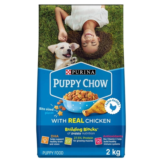 Purina Puppy Chow Complete with Real Chicken dry puppy food 2 kg bag with blue packaging featuring a bowl of bite-sized kibble and a chicken drumstick illustration, highlighting 27.5% protein for growing muscles, DHA for brain and vision support, and antioxidants like vitamin C for immune health.