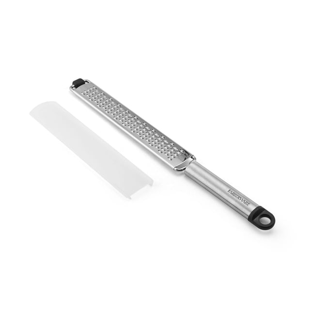 Farberware Stainless Steel Zester with a long, narrow bi-directional grating surface and brushed stainless steel handle with black hanging loop, shown with a white protective cover, suitable for zesting citrus, grating cheese, or ginger.