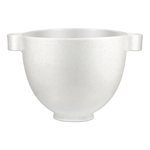 KitchenAid® 5 Quart Speckled Stone Ceramic Bowl in white with fine dark speckles, rounded with two flat handles, made from titanium-reinforced ceramic that resists chipping and staining, freezer, microwave, dishwasher, and oven safe, fits 4.5 and 5 quart tilt-head stand mixers, also suitable as a versatile mixing bowl for various kitchen tasks.