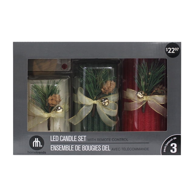 Hometrends Ensemble de Bougies Piliers à DEL à Feuillage Cannelé avec Télécommande Comprenant Trois Bougies Piliers en Vraie Cire en Ivoire, Vert et Rouge avec Aiguille de Pin, Pomme de Pin et Breloques Cloche Dorées Ligaturées avec des Rubans Dorés Transparents, Lumières DEL Vacillantes et Fonction Marche/arrêt de la Télécommande, Emballé dans une Boîte Grise avec Fenêtre Transparente pour Décoration de Noël Intérieure.