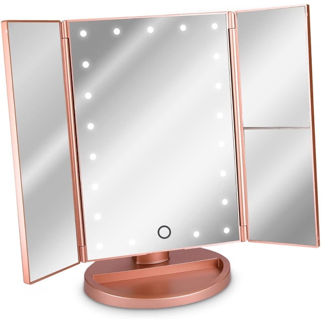 Led Cosmetic Mirror Foldable Standing Mirror in rose gold with illuminated LED lights and a trifold design. Includes 1x, 2x, and 3x magnification panels, a touch sensor for dimmable brightness, and a storage base for makeup and jewelry. Suitable as a lighted makeup mirror for precise grooming. Operates via USB or 4x AAA batteries.