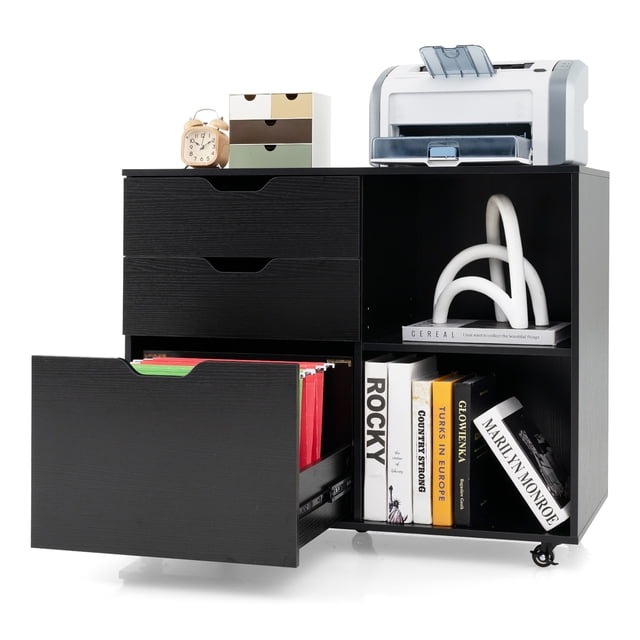 Gymax 3-Drawer Mobile File Cabinet in black designed for home office use, featuring a spacious desktop with a printer, three drawers, and two open adjustable storage compartments. The file drawer is open, showcasing organized files, while the shelves hold books and decorative items. Includes five universal casters for easy mobility.