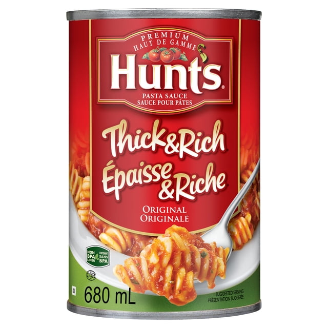 Hunt's® Original Thick & Rich Pasta Sauce 680 mL can with red and green label featuring rotini pasta coated in thick tomato sauce on a fork, made from vine-ripened tomatoes using a natural steam process, ideal for enhancing pasta meals.
