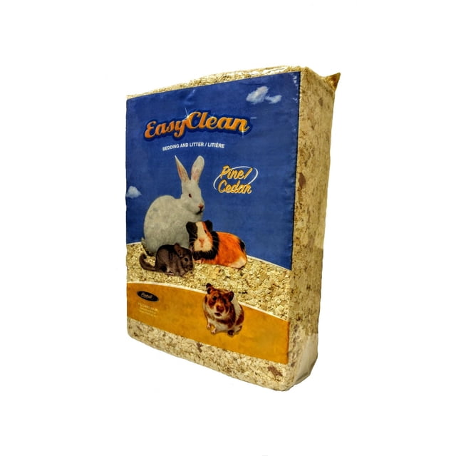 Pestell Easy Clean Pine/Cedar Bedding & Litter 40L/2440 cu.in. compressed block with visible natural pine and cedar shavings. The blue label features images of a white rabbit, guinea pig, chinchilla, and hamster, showing its use for small animals and reptiles. This ultra absorbent bedding provides a fresh natural scent for a clean habitat.