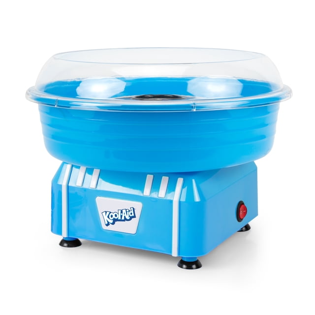 Kool-Aid Cotton Candy Maker, Blue, a small appliance with a bright blue plastic base and white accents, topped with a clear protective rim guard. It features a red power switch and the Kool-Aid logo on the front. Designed for making cotton candy cones at home using flossing sugar or hard candies.