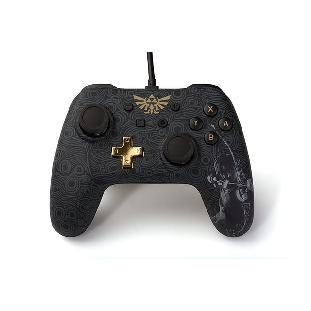 ATTOE Wired Controller for ATTOE Switch - Zelda: Breath of The Wild. This officially licensed PowerA wired controller features a black top with a Legend of Zelda pattern, Hylian Shield icon, and an action pose of Link. It includes coloured ABXY buttons, a metallic gold D-pad, and a detachable 10ft USB cable with a Velcro strap for easy storage.